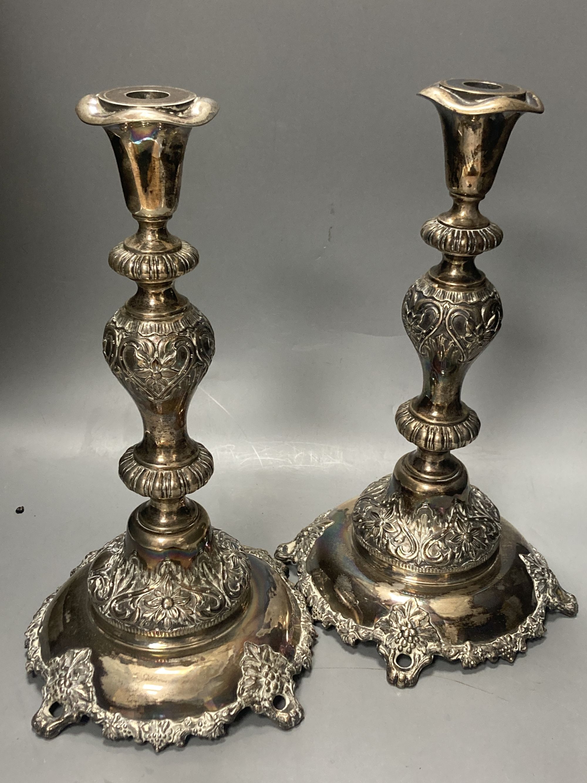 A pair of large Russian late 19th century 84 zolotnik Sabbath Day candlesticks, stamped Pogorzelski, dated 1892,